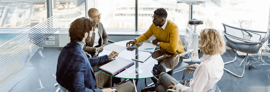 Group Of Business Person In Discussion In The Office